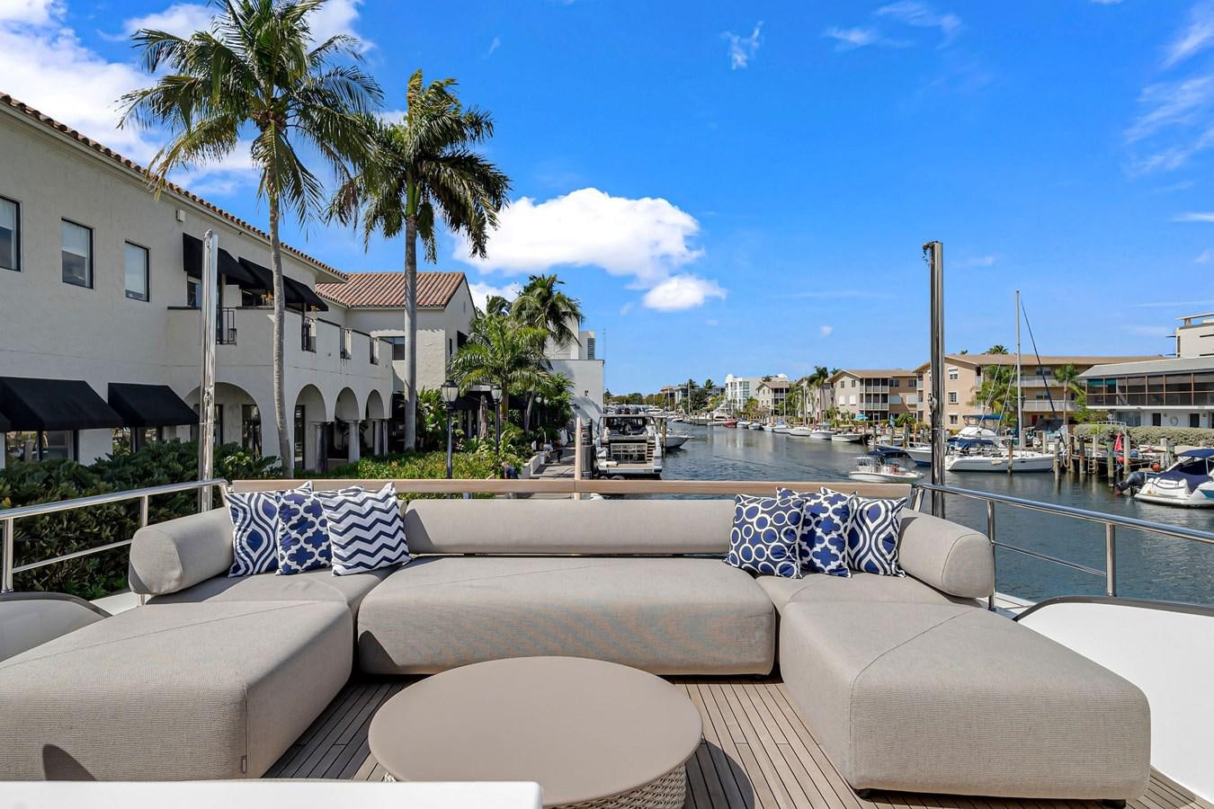 a couch and chairs in front of a pool aboard SL86/728 Yacht for Sale