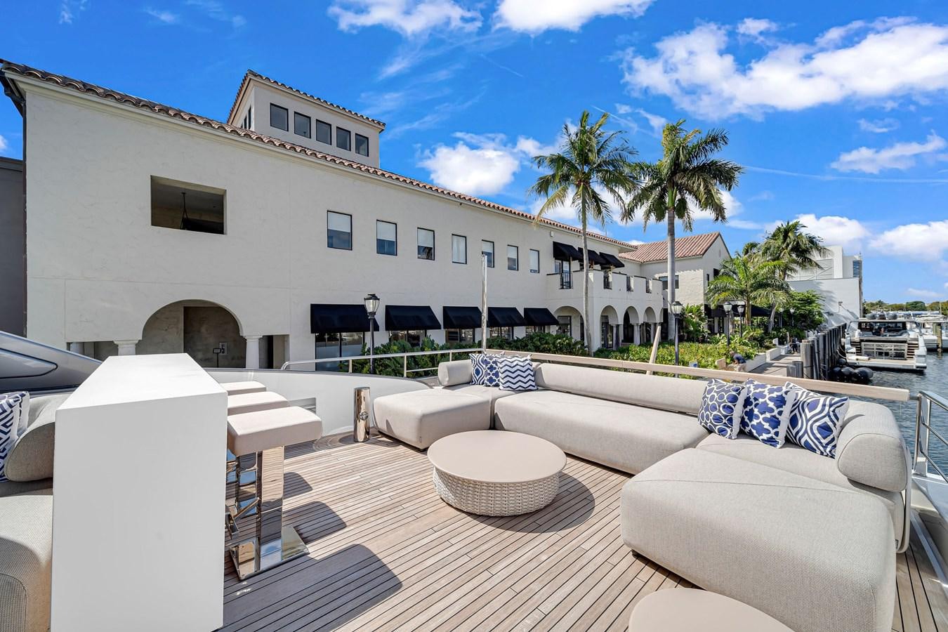 a large white building with palm trees aboard SL86/728 Yacht for Sale