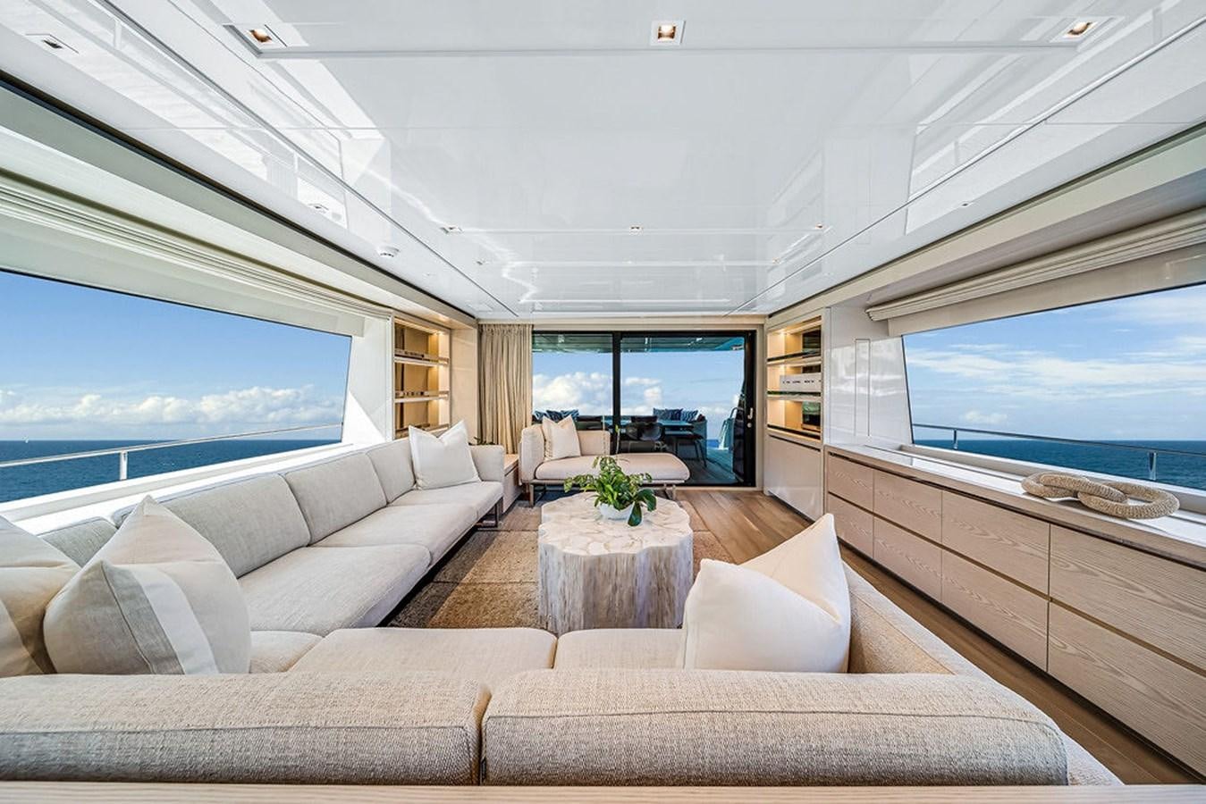 a living room with a large window aboard SL86/728 Yacht for Sale
