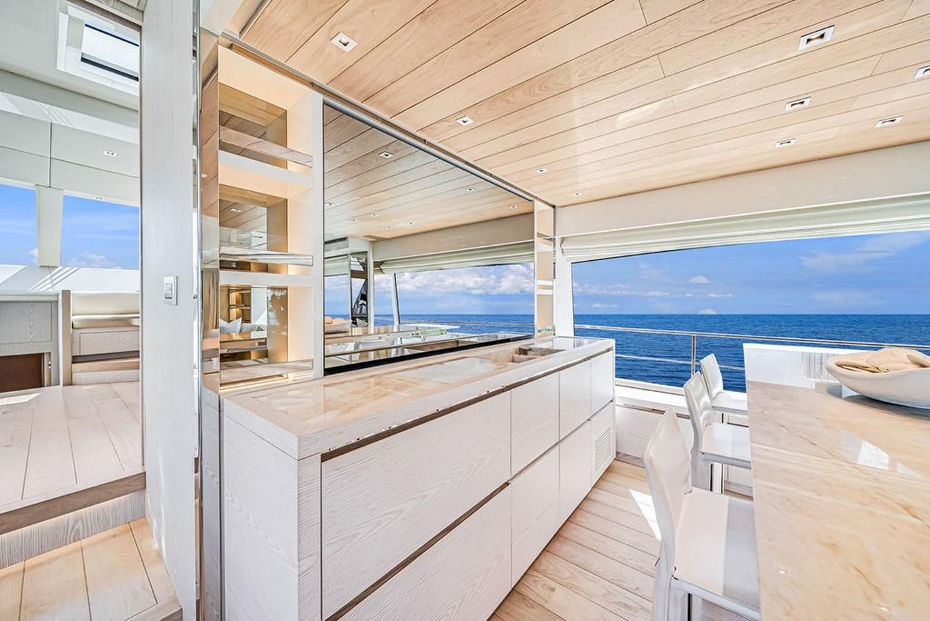 a room with a table and chairs aboard SL86/728 Yacht for Sale