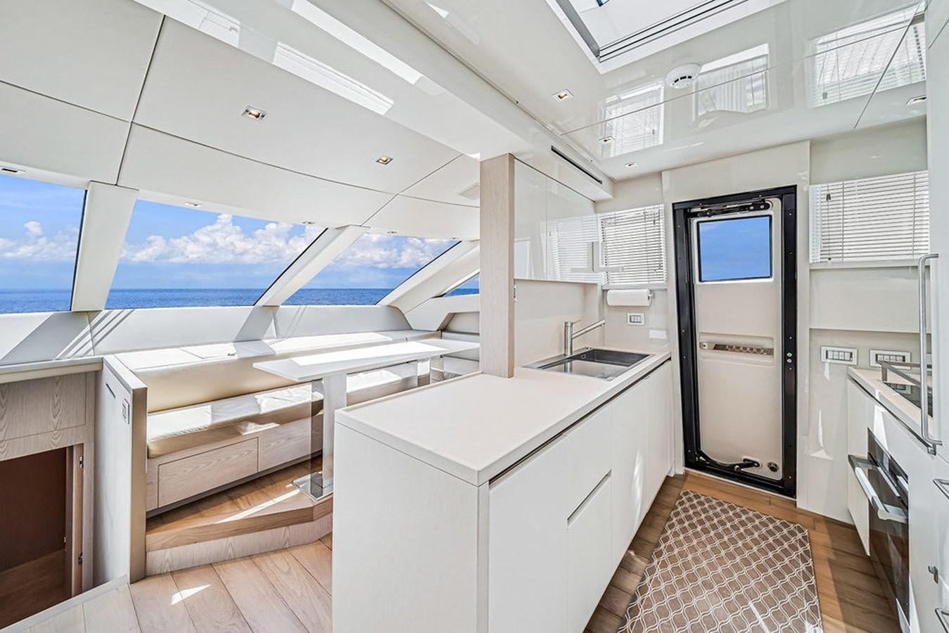 a room with a large window and a desk with a computer on it aboard SL86/728 Yacht for Sale