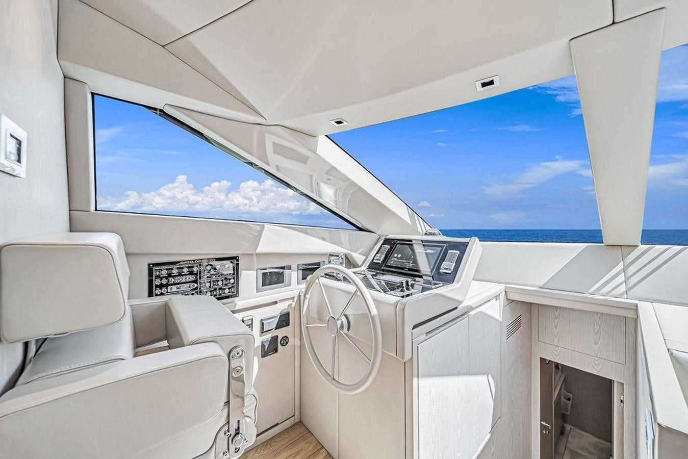 a white car with a large window aboard SL86/728 Yacht for Sale