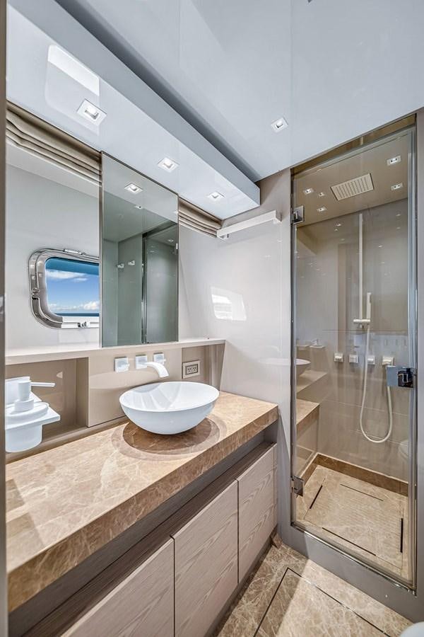 a bathroom with a sink and a mirror aboard SL86/728 Yacht for Sale