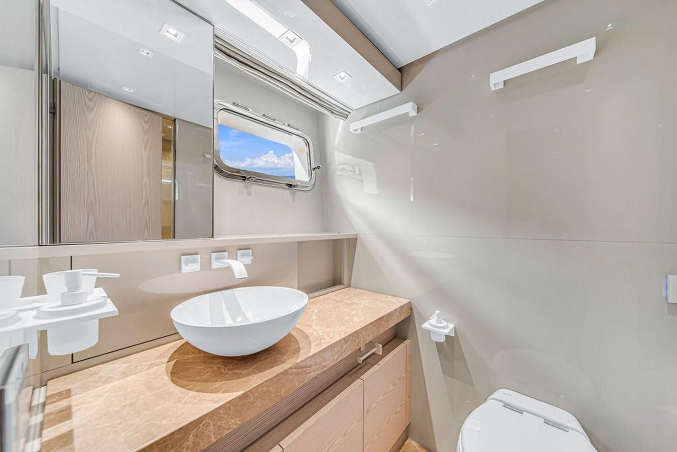 a bathroom with a sink and a mirror aboard SL86/728 Yacht for Sale