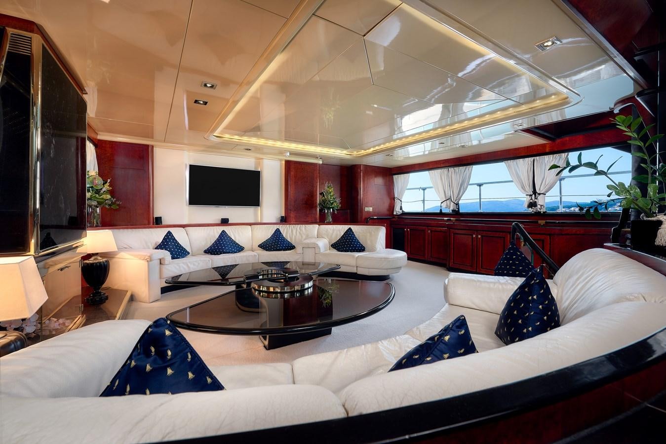 a large room with a couch and a coffee table aboard LADY SUNSHINE Yacht for Sale