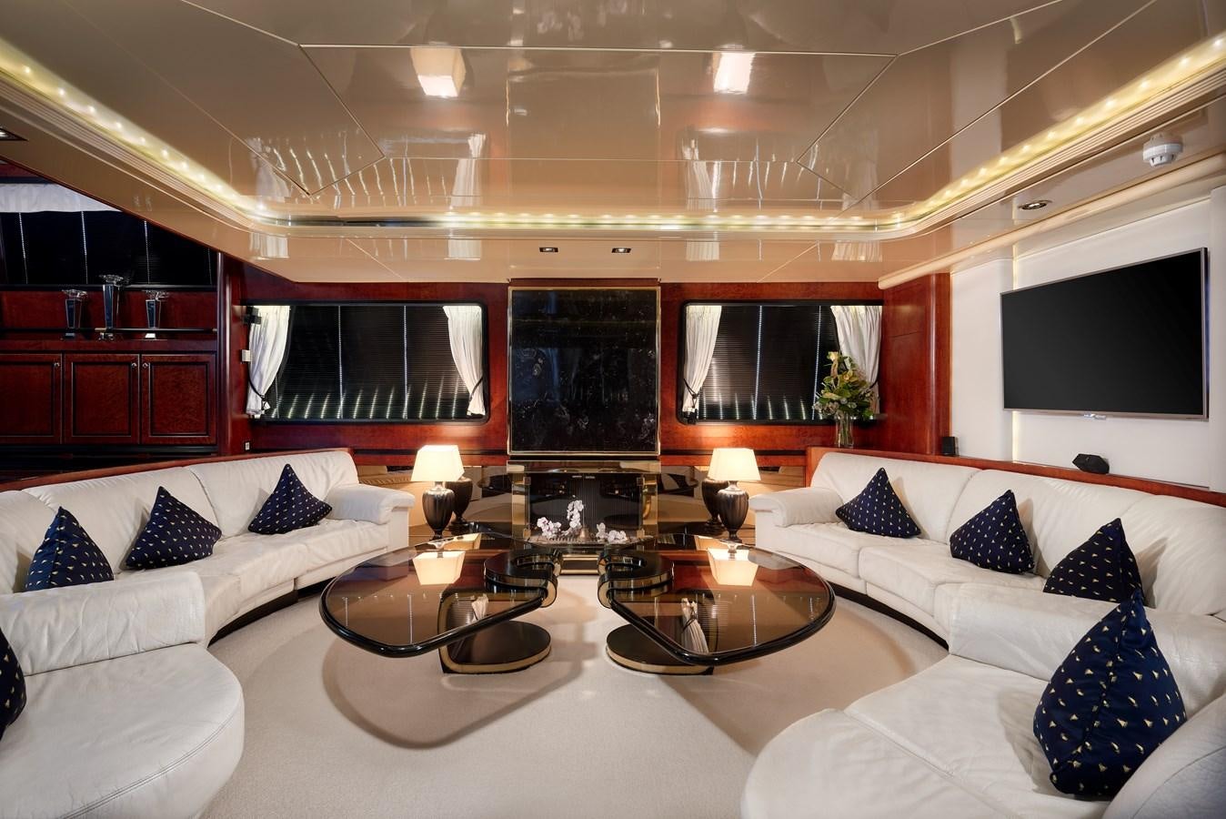 a large room with a large white bed and a large television aboard LADY SUNSHINE Yacht for Sale