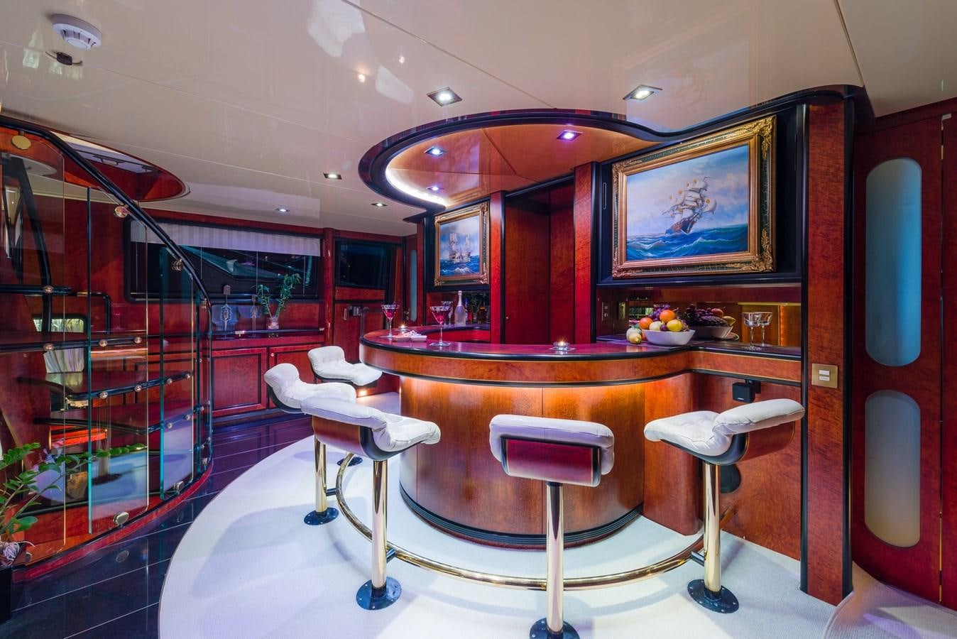 a room with a table chairs and a mirror aboard LADY SUNSHINE Yacht for Sale