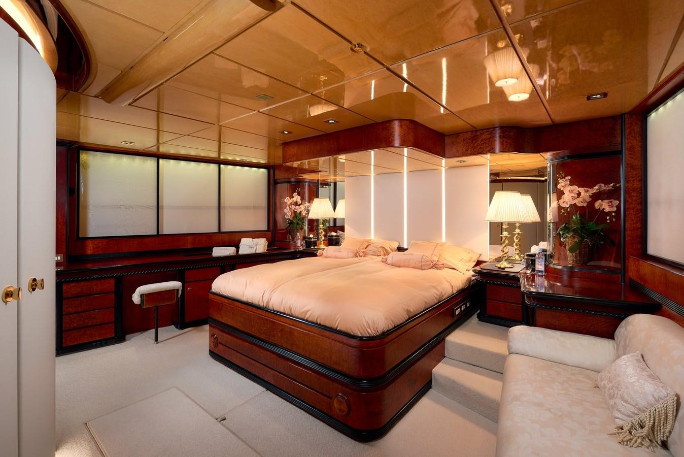a bedroom with a bed and a couch aboard LADY SUNSHINE Yacht for Sale