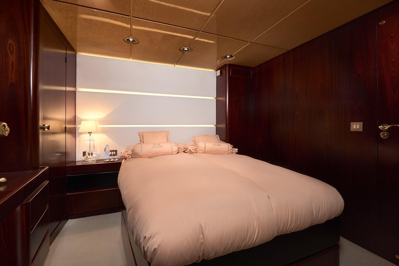 a bed in a room aboard LADY SUNSHINE Yacht for Sale