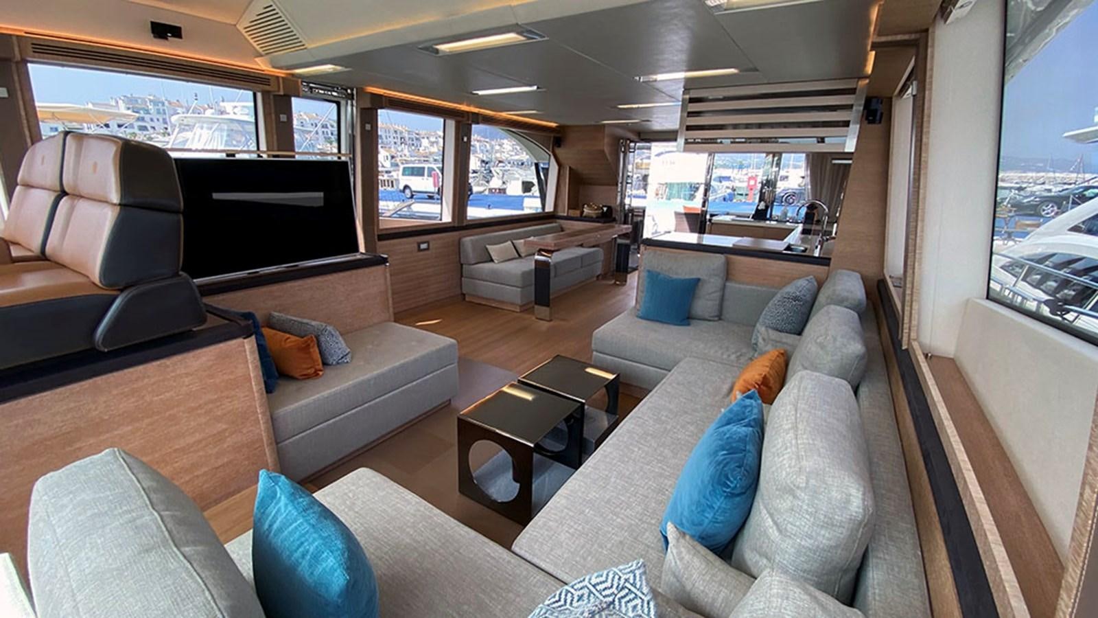 a living room with a couch and a coffee table aboard CAPPUCCINO Yacht for Sale