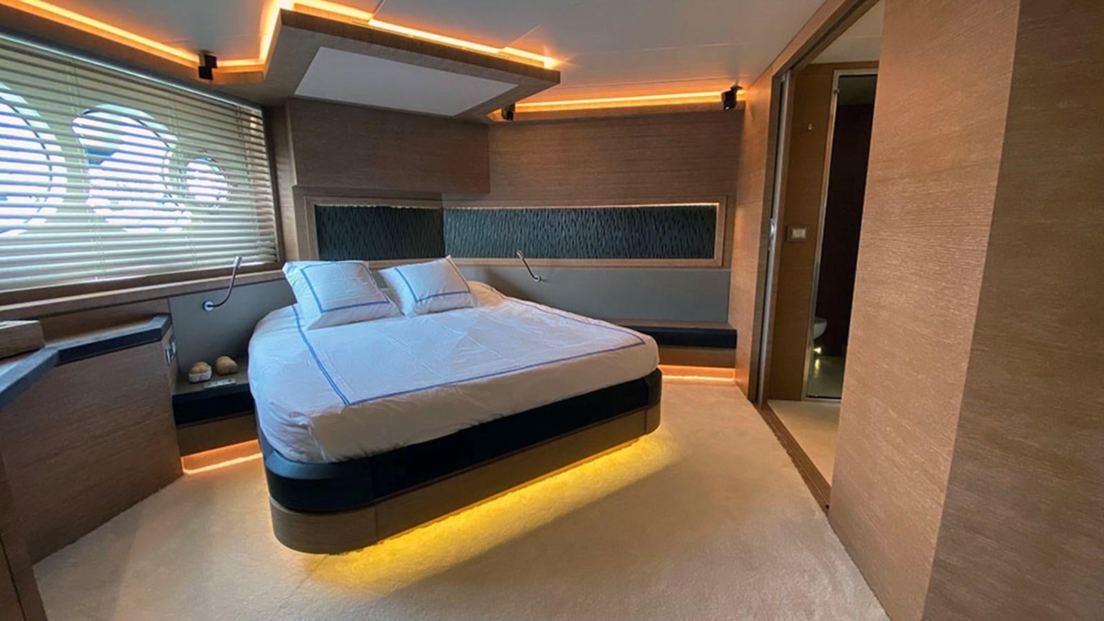 a room with a bed and a window aboard CAPPUCCINO Yacht for Sale