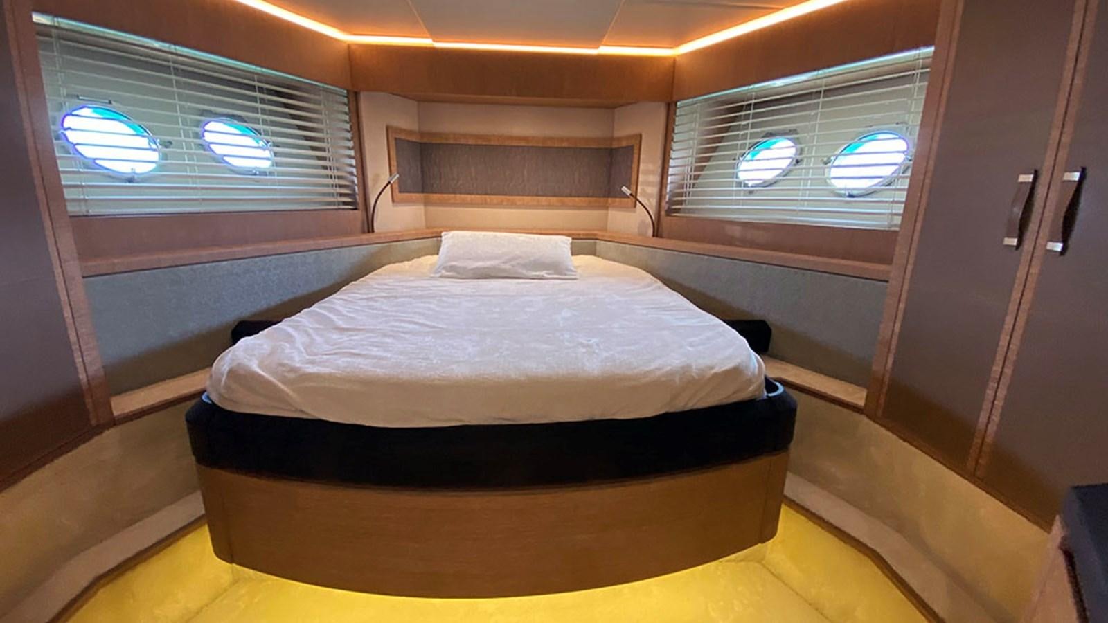 a bed in a room aboard CAPPUCCINO Yacht for Sale