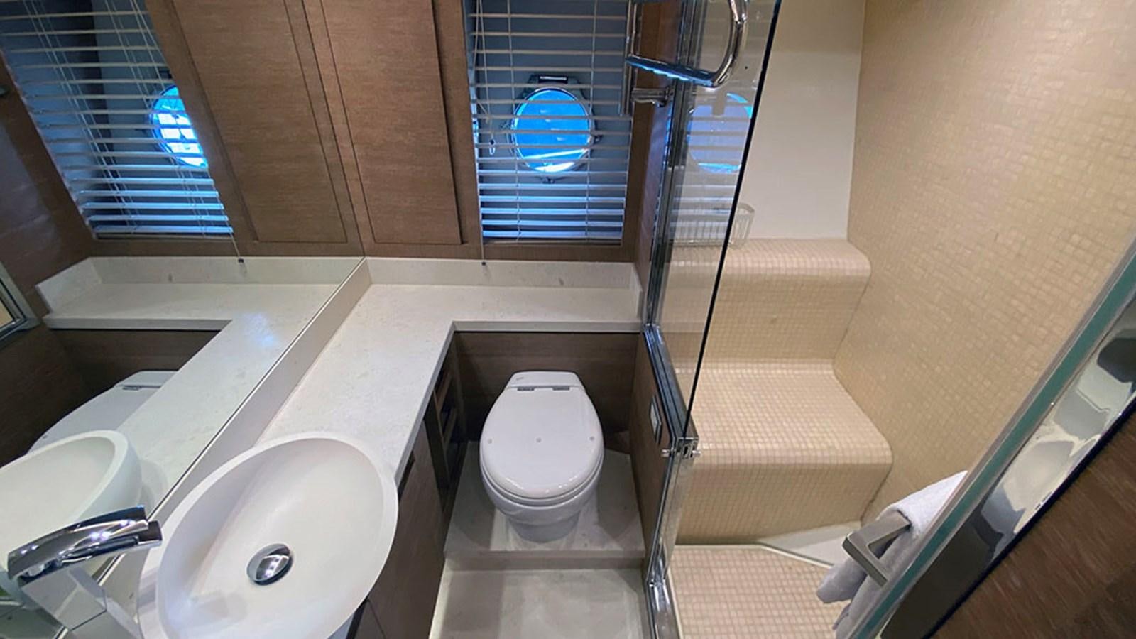 a bathroom with a glass shower aboard CAPPUCCINO Yacht for Sale
