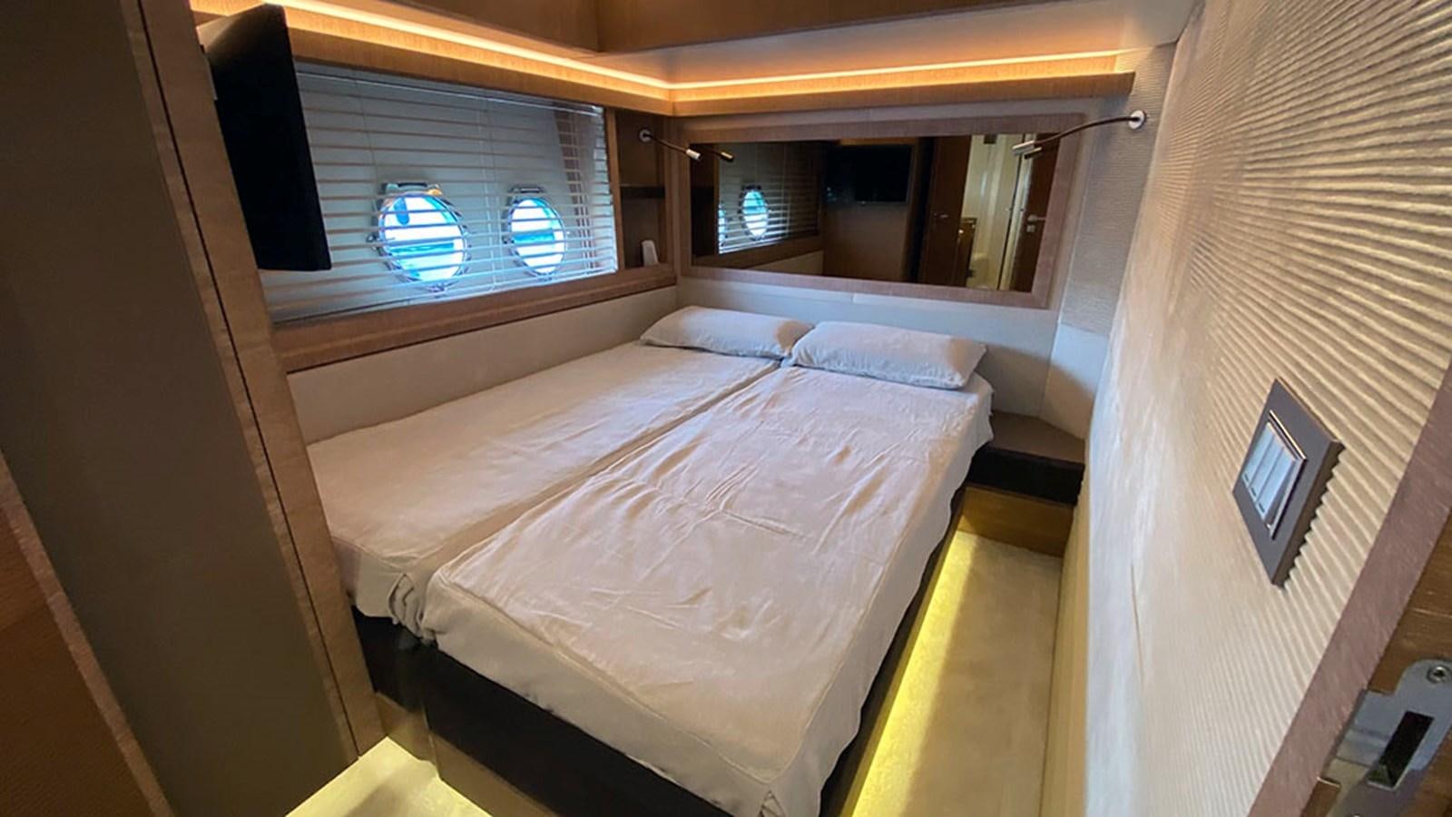 a room with a bed and a window aboard CAPPUCCINO Yacht for Sale
