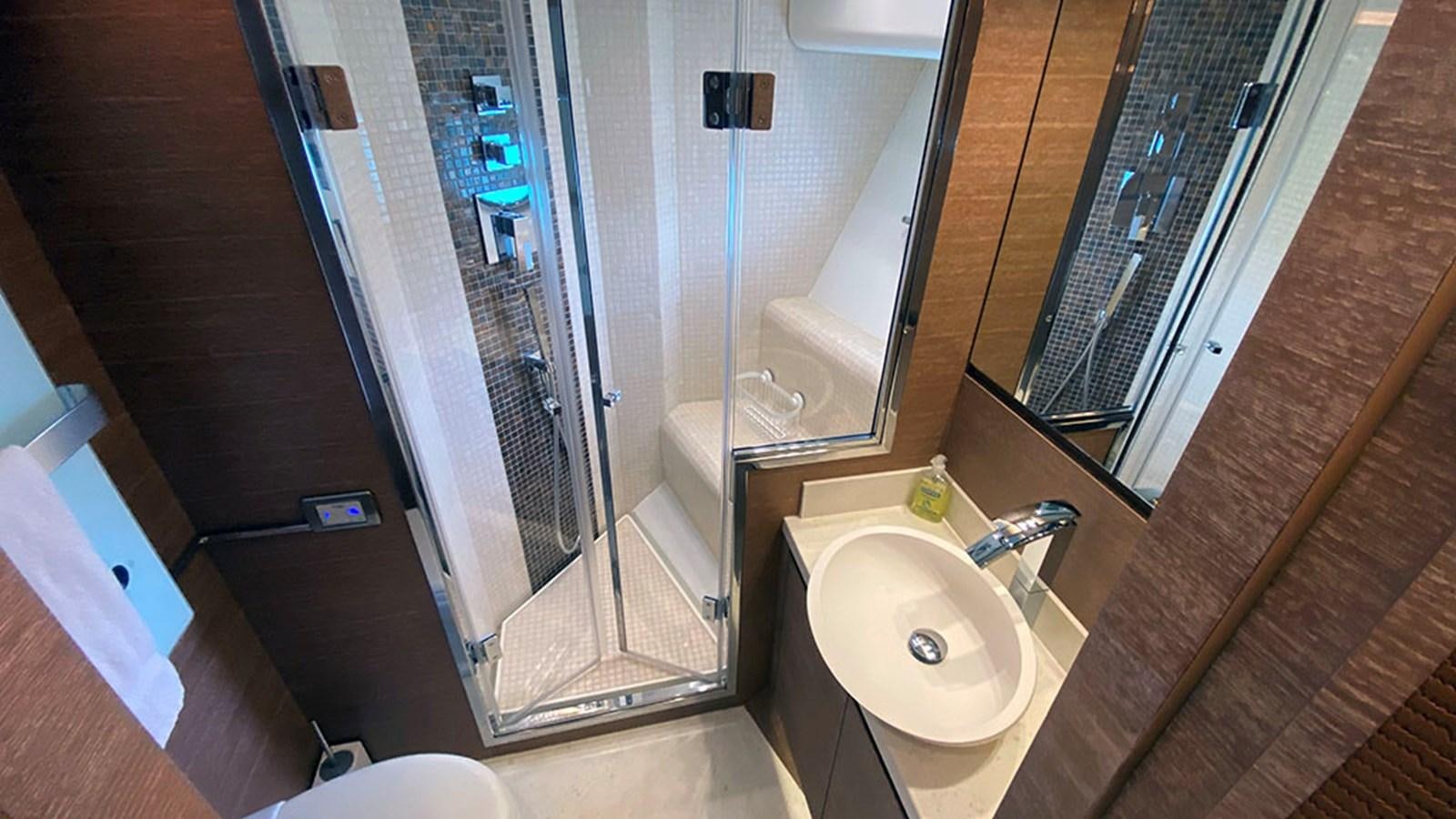 a bathroom with a sink and a shower aboard CAPPUCCINO Yacht for Sale
