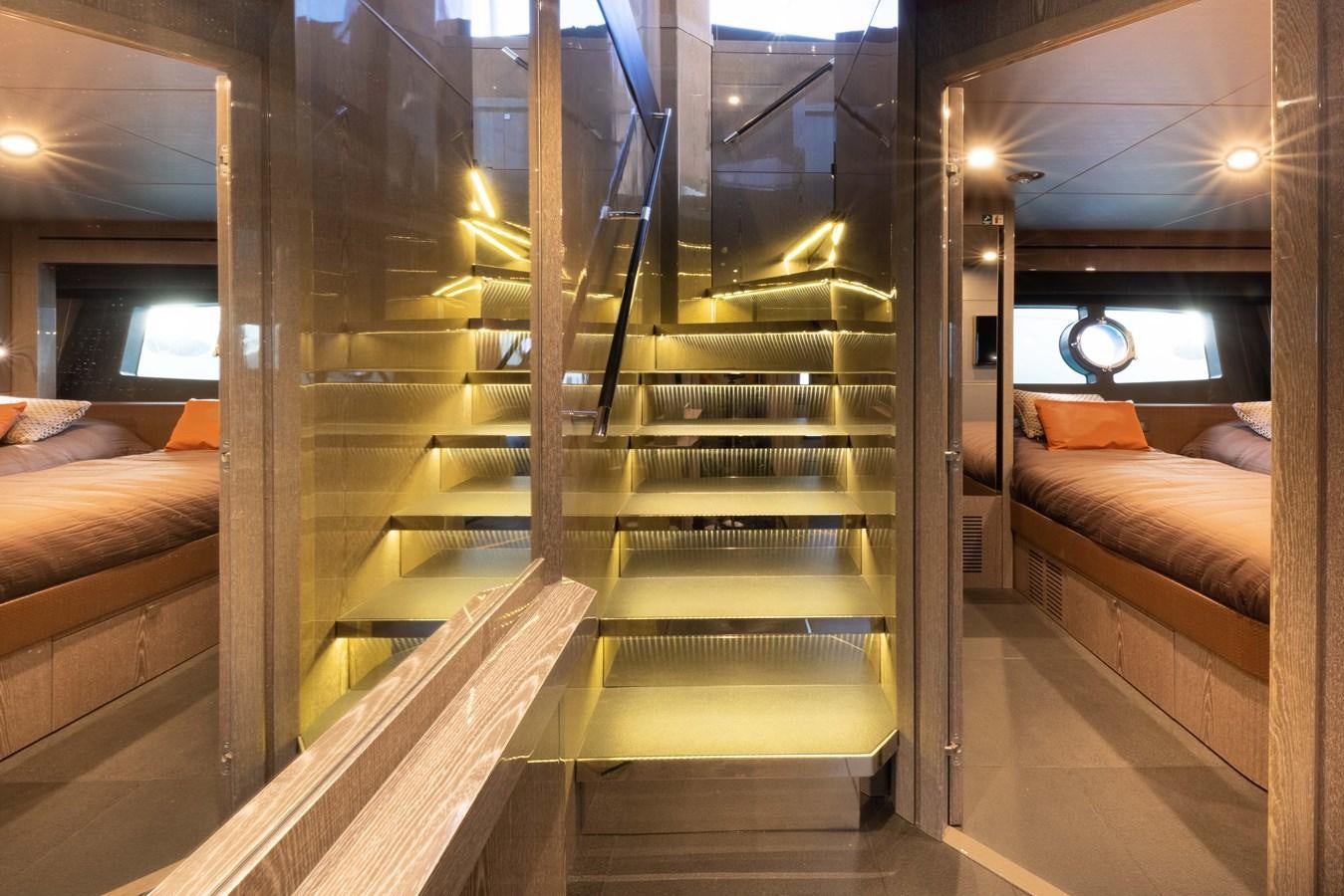 a room with a bed and a couch aboard MIRKA Yacht for Sale