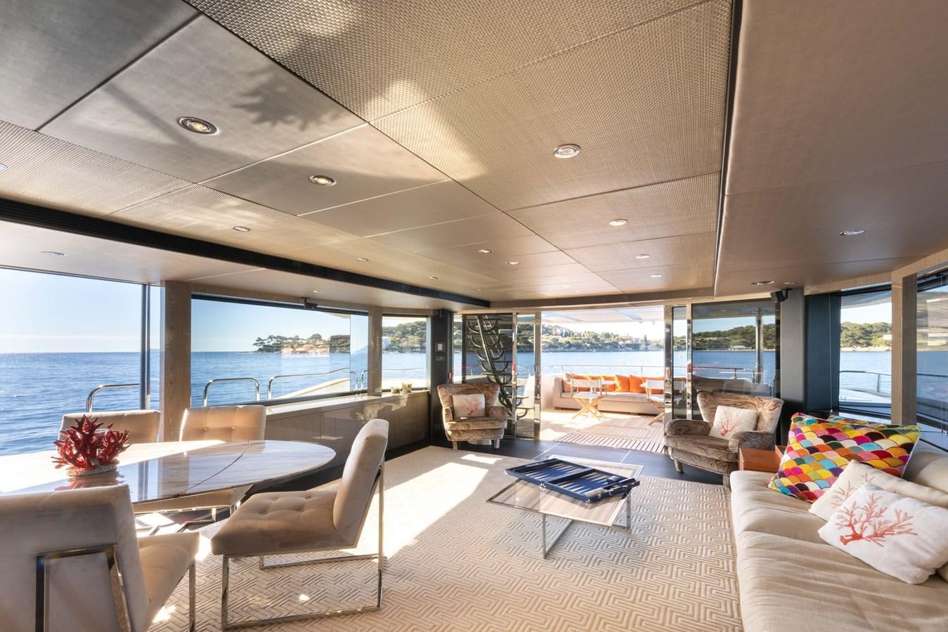 a living room with a large window aboard MIRKA Yacht for Sale