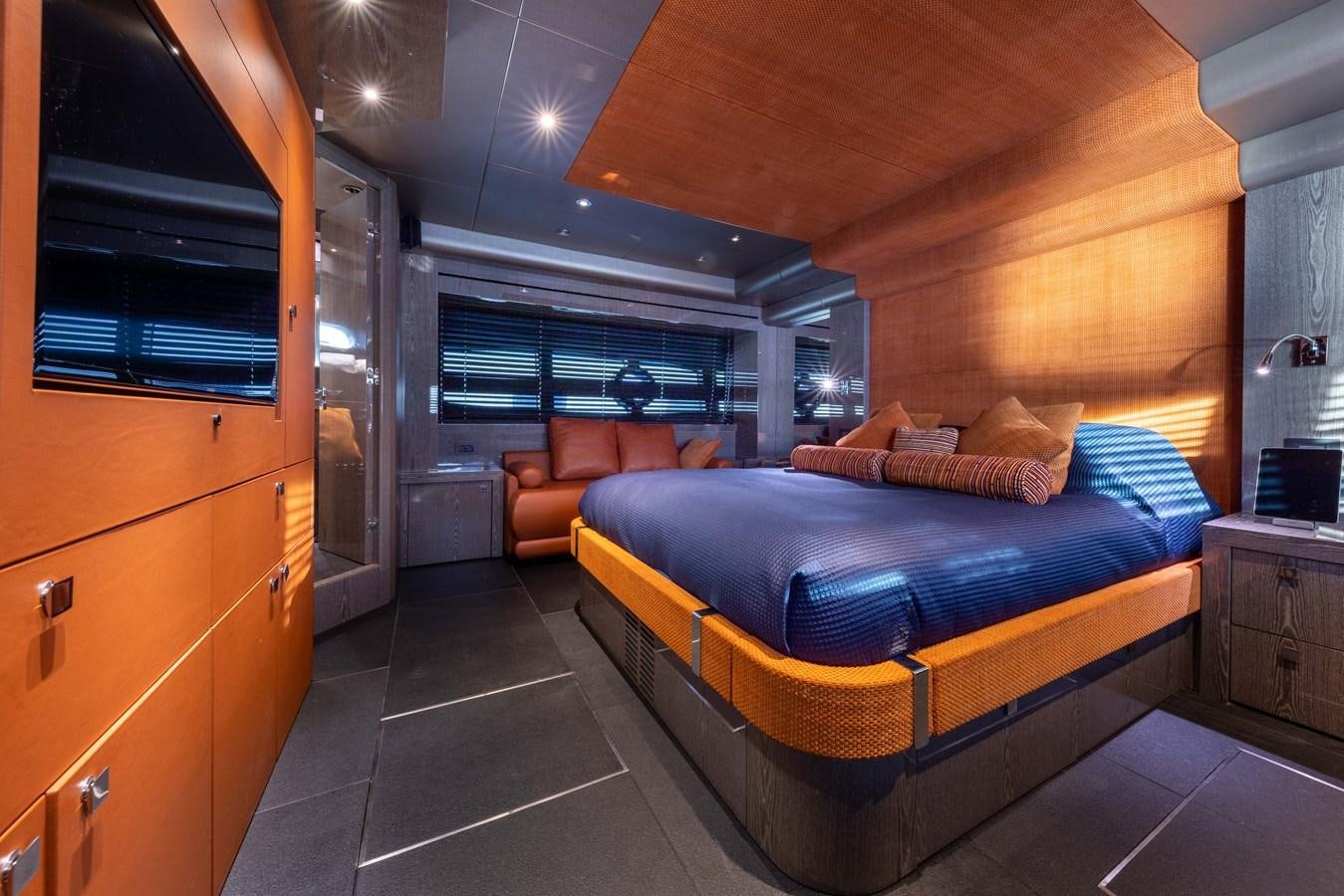 a bedroom with a bed and a desk aboard MIRKA Yacht for Sale