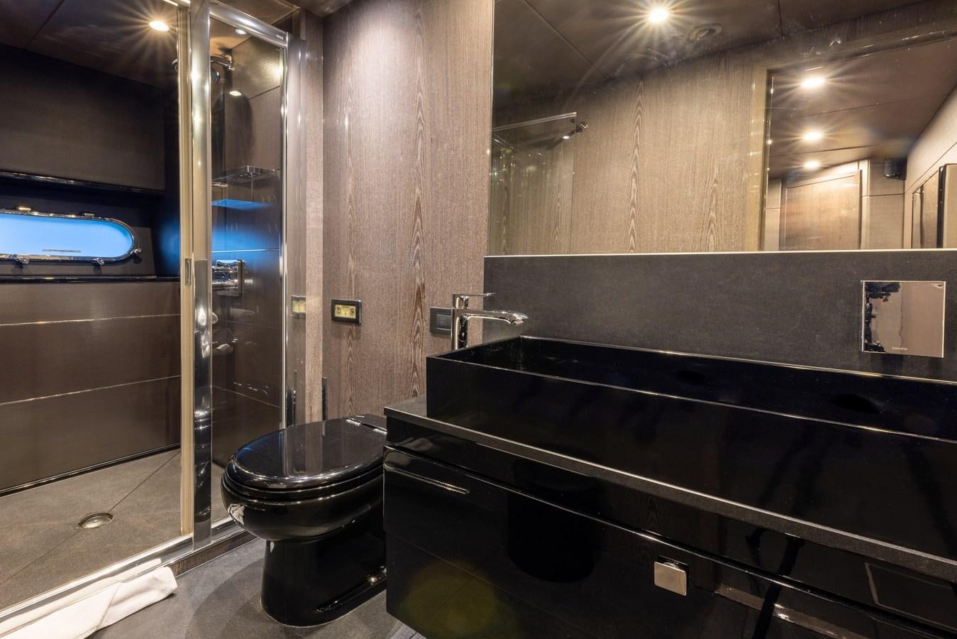 a bathroom with a glass shower aboard MIRKA Yacht for Sale