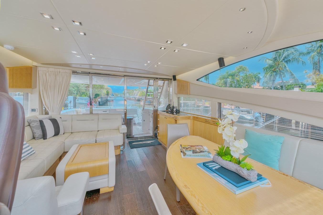 a living room with a large window aboard MISS INGRID Yacht for Sale