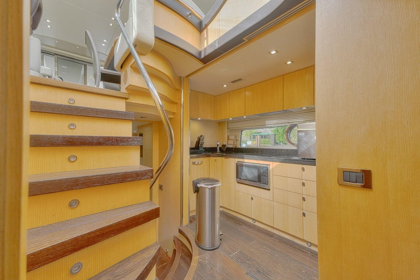 a kitchen with wooden cabinets aboard MISS INGRID Yacht for Sale