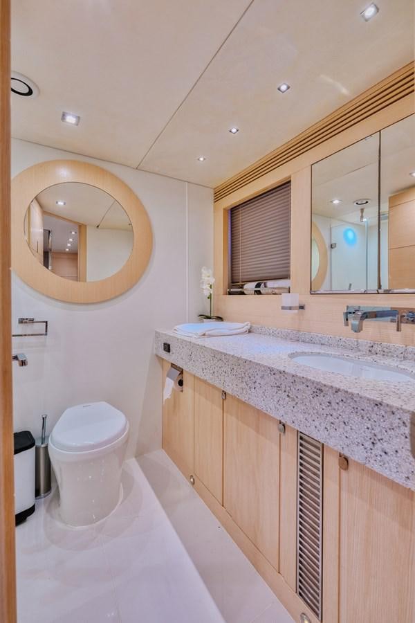 a bathroom with a large mirror aboard MISS INGRID Yacht for Sale