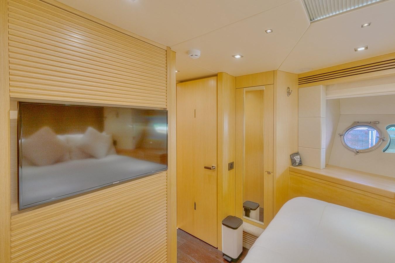 a room with a bed and a window aboard MISS INGRID Yacht for Sale