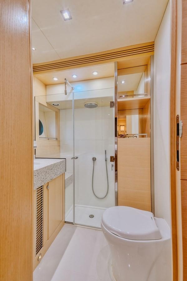 a bathroom with a shower unit and a toilet aboard MISS INGRID Yacht for Sale
