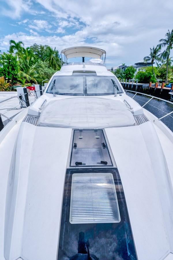 a white boat with a black deck aboard MISS INGRID Yacht for Sale