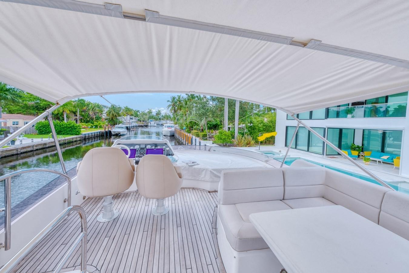 a large white tent with chairs and tables on it aboard MISS INGRID Yacht for Sale