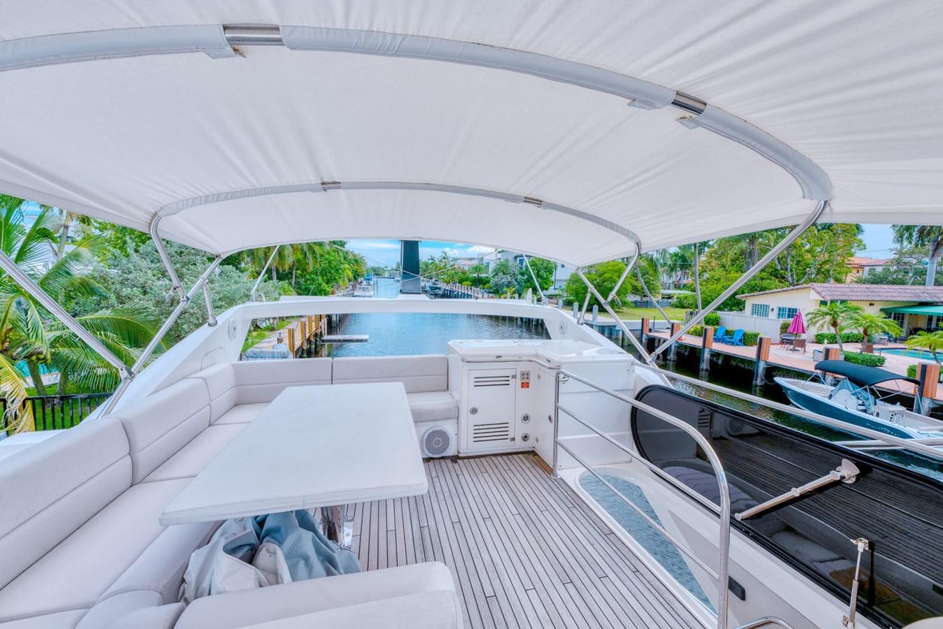 a deck with a pool and a deck with a deck and a view of the water aboard MISS INGRID Yacht for Sale