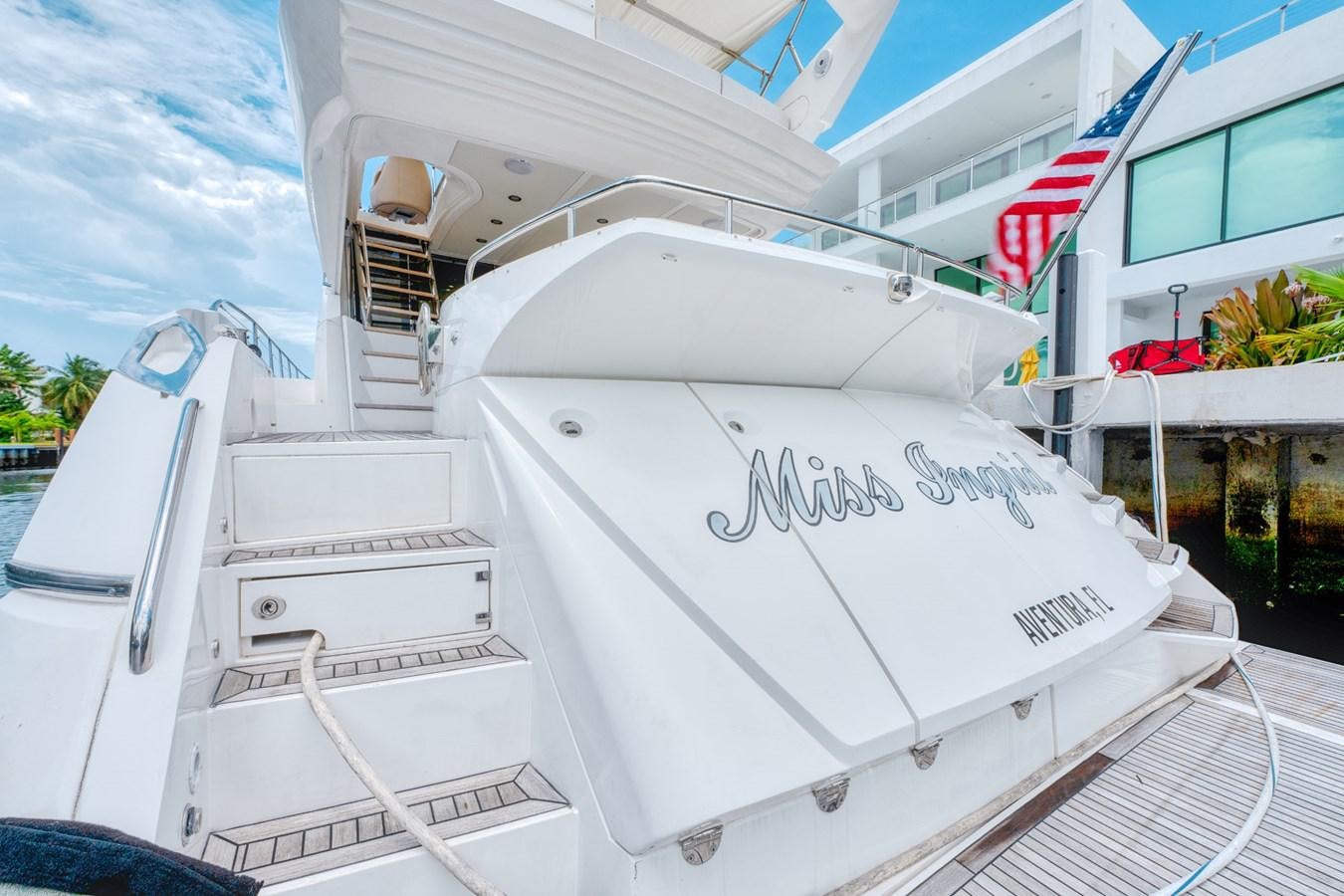 a white boat on a dock aboard MISS INGRID Yacht for Sale