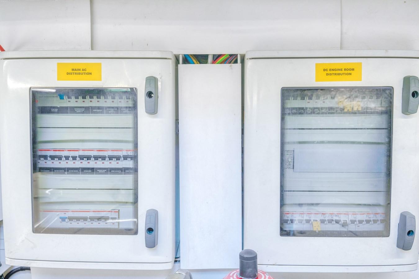 a white rectangular object with a yellow label on it aboard MISS INGRID Yacht for Sale