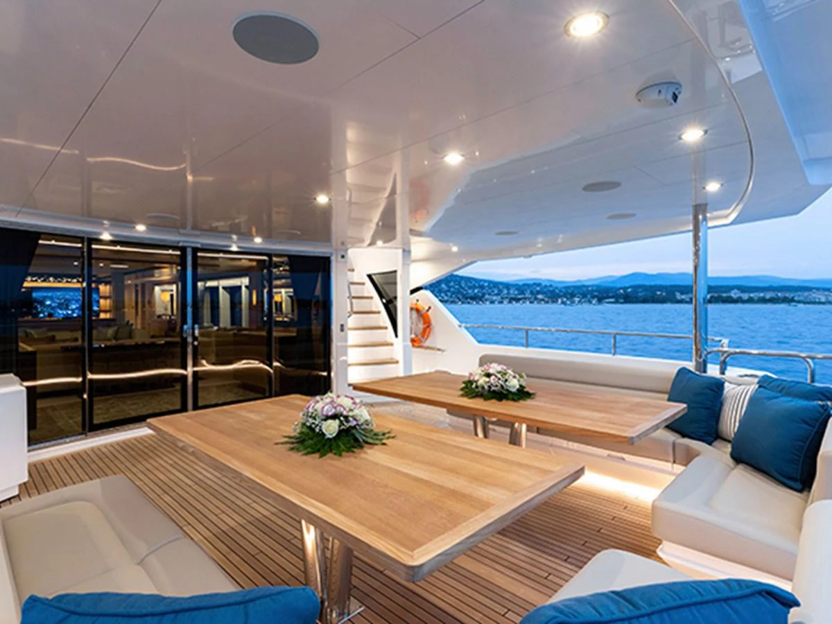 a room with a table and chairs aboard ELYSIUM Yacht for Sale