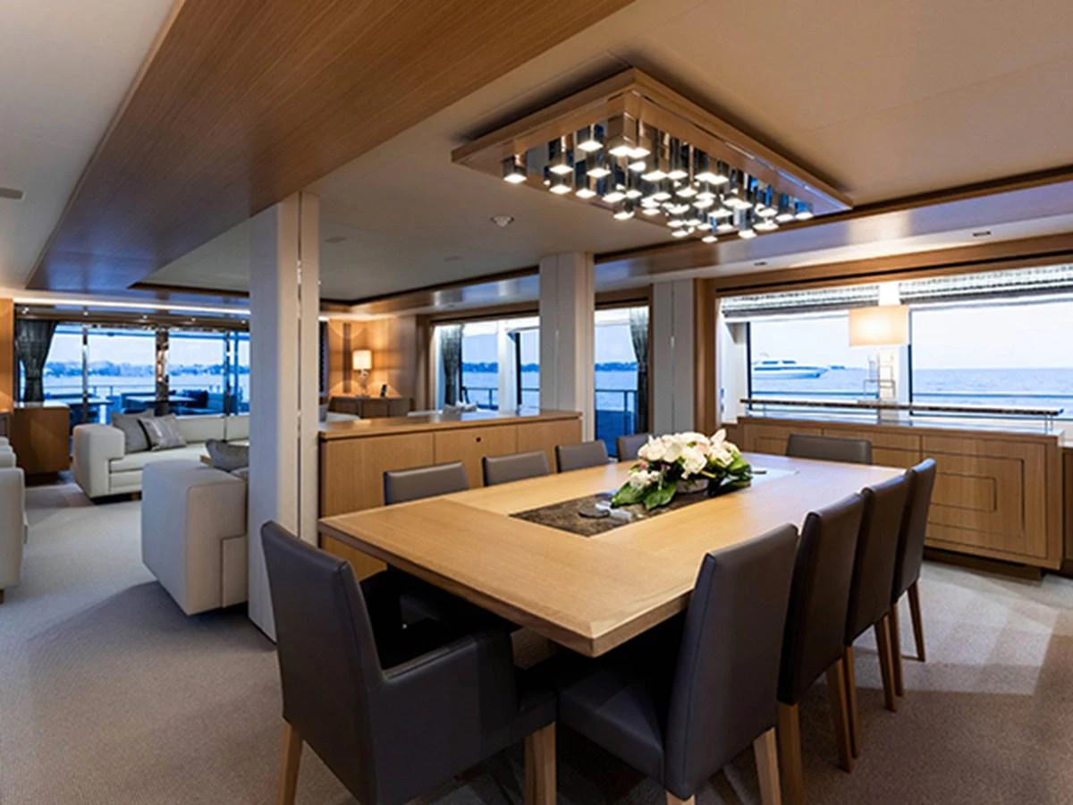 a large dining room with a large table and chairs aboard ELYSIUM Yacht for Sale