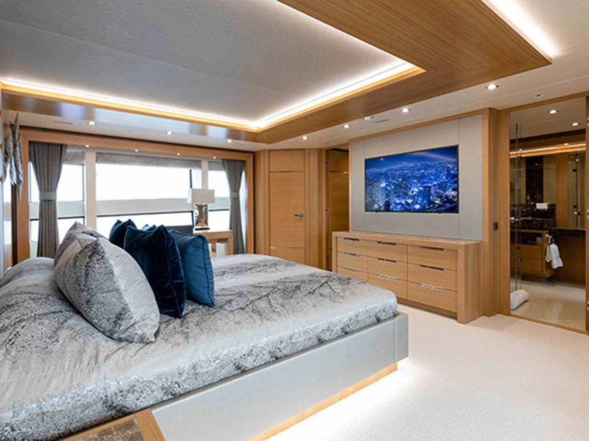 a bed in a room aboard ELYSIUM Yacht for Sale