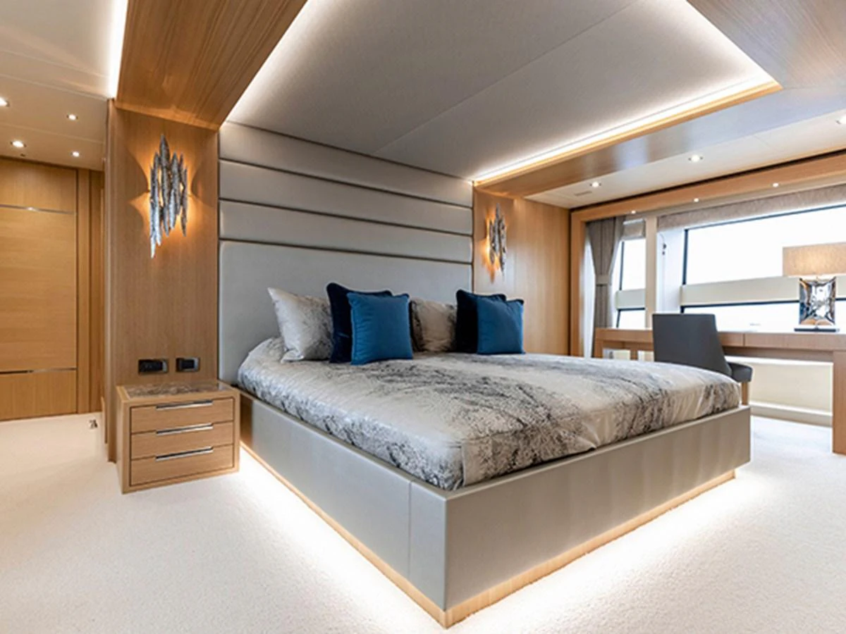 a large bed in a room aboard ELYSIUM Yacht for Sale