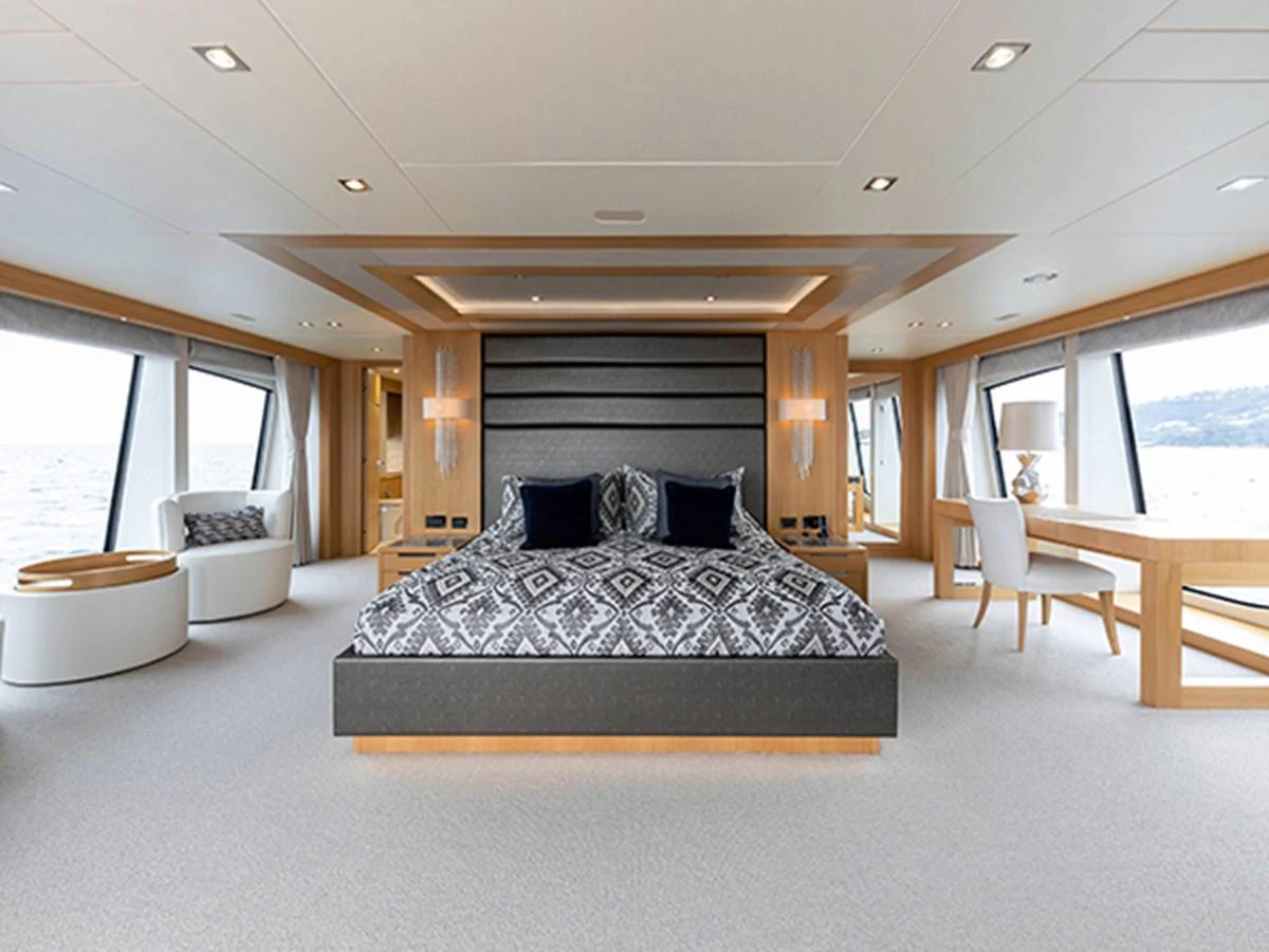 a large bed in a room aboard ELYSIUM Yacht for Sale