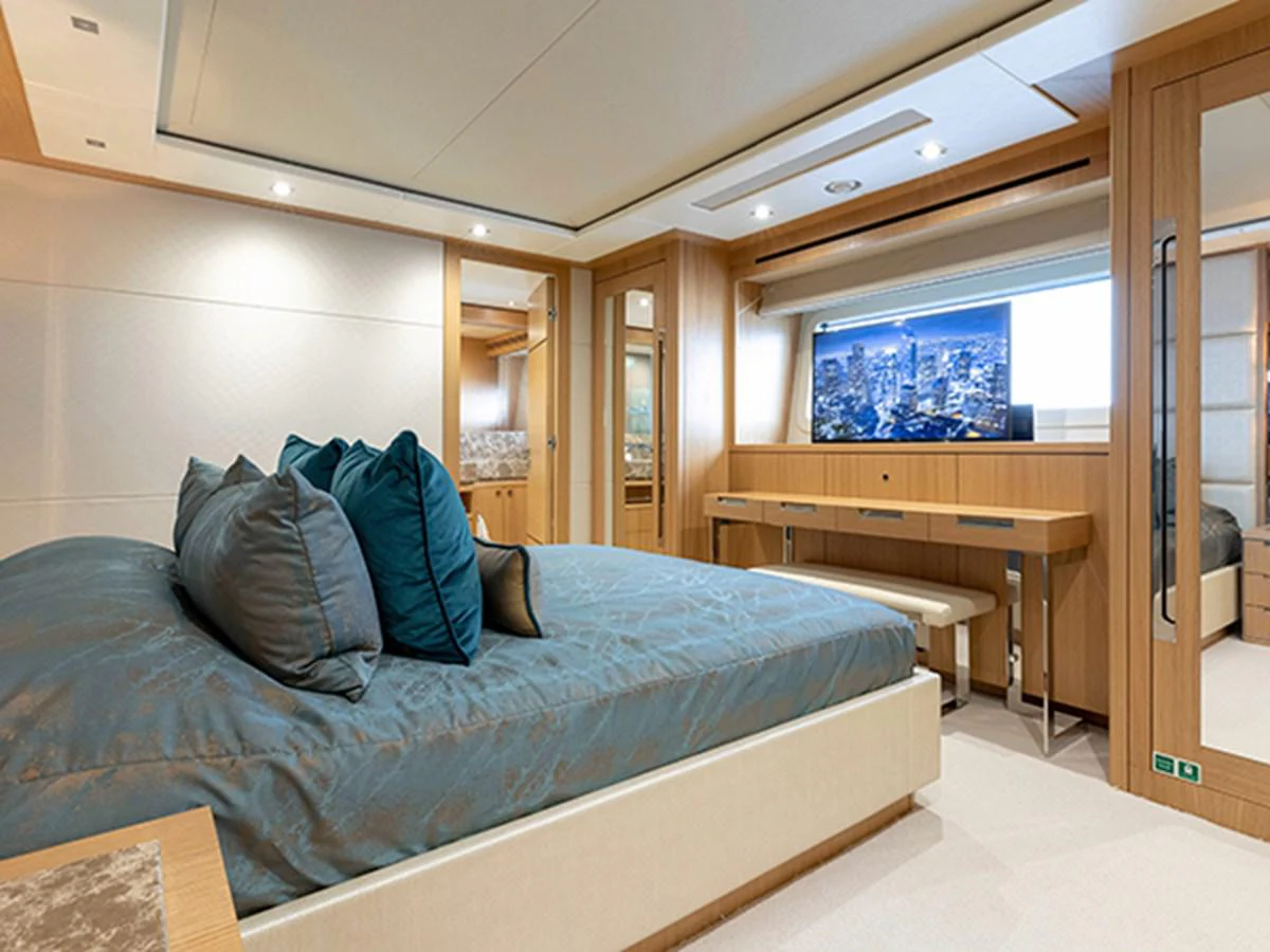 a bed in a room aboard ELYSIUM Yacht for Sale