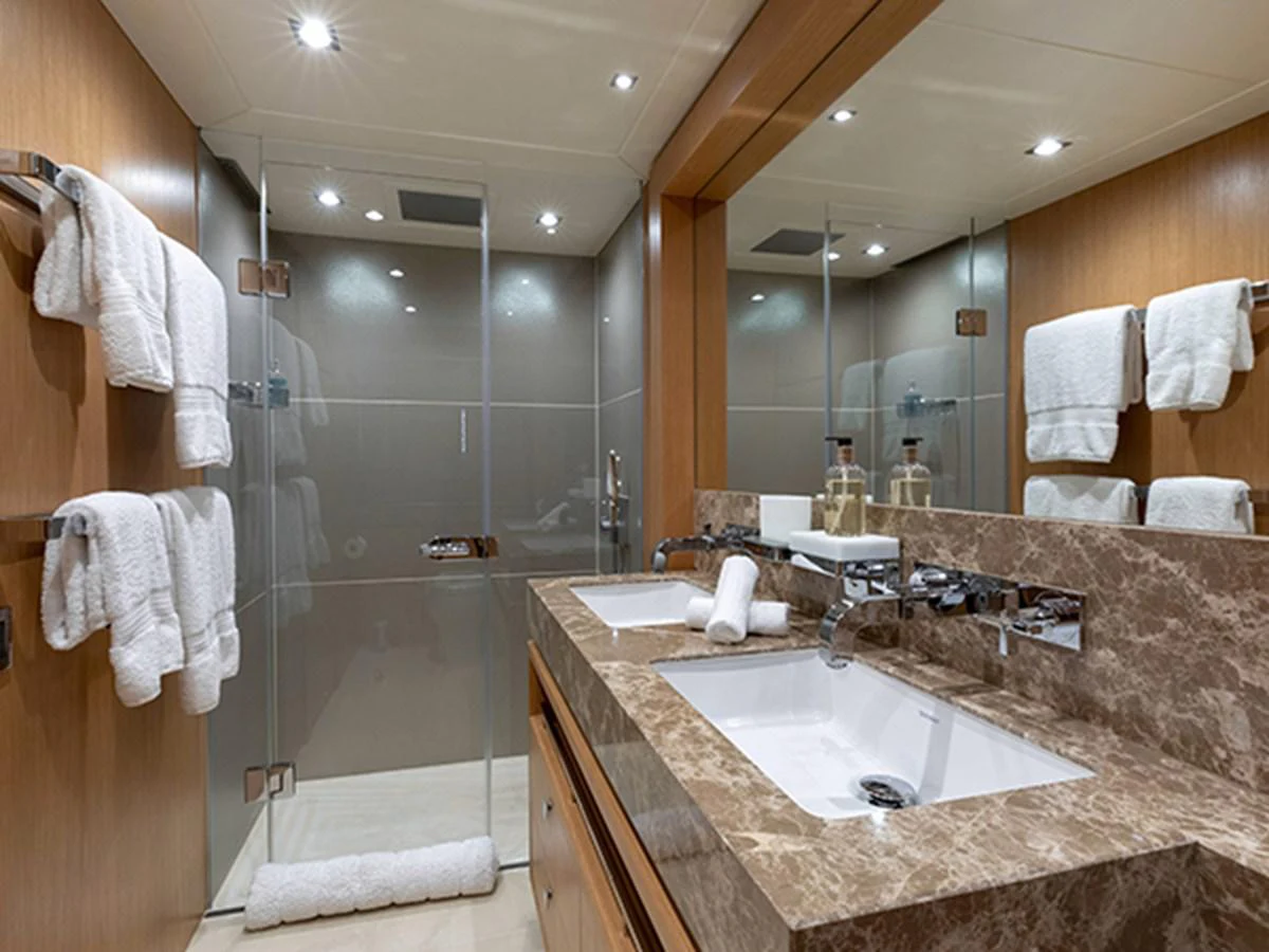 a bathroom with a large mirror aboard ELYSIUM Yacht for Sale