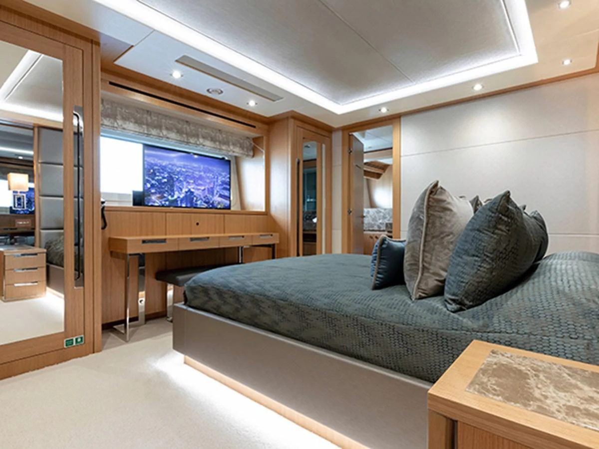 a bed in a room aboard ELYSIUM Yacht for Sale