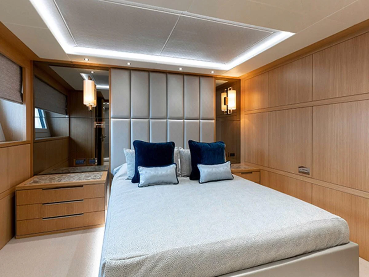 a bed in a room aboard ELYSIUM Yacht for Sale