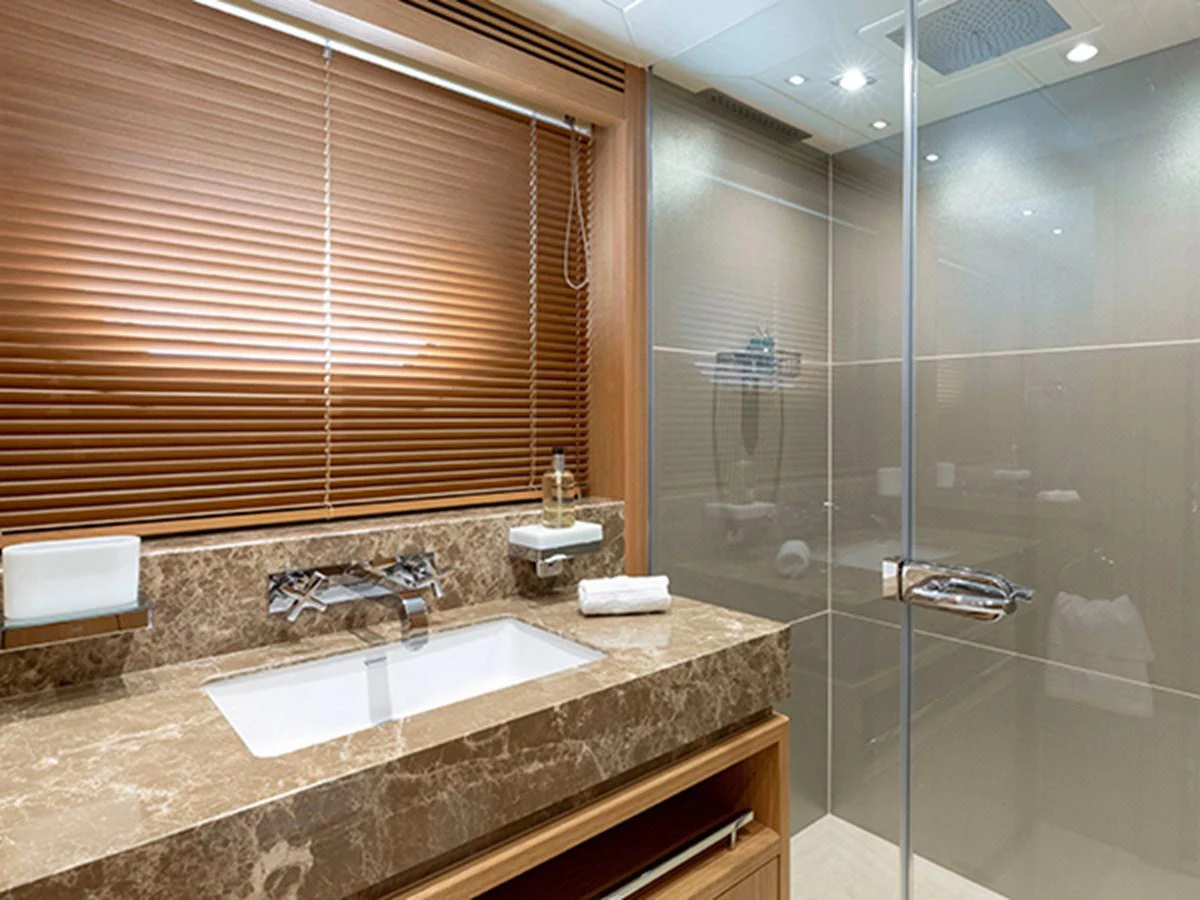 a bathroom with a glass shower aboard ELYSIUM Yacht for Sale