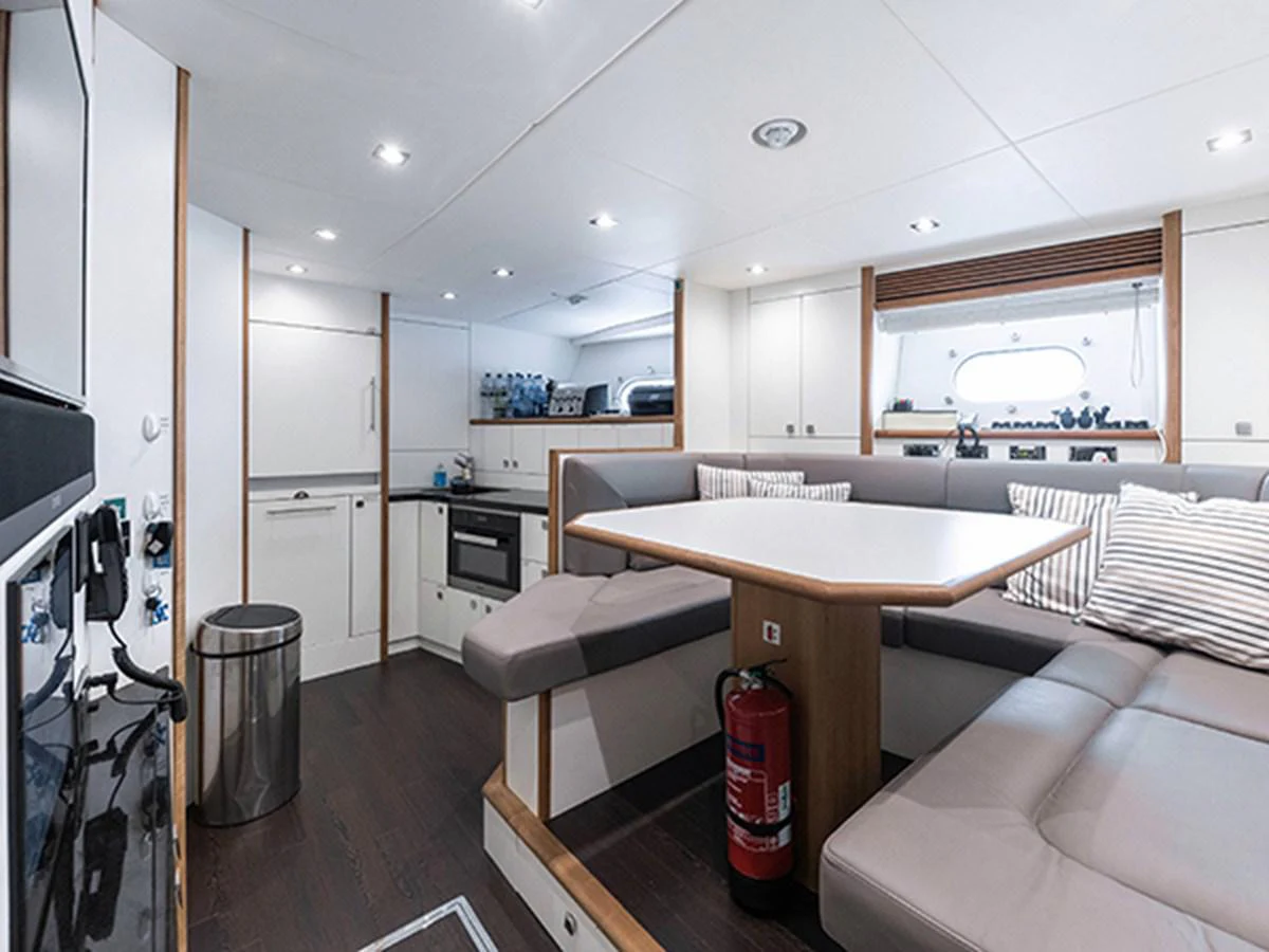 a kitchen and living room aboard ELYSIUM Yacht for Sale