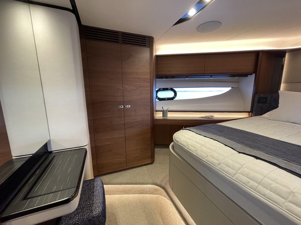 a room with a bed and a desk aboard PRINCESS S78 Yacht for Sale