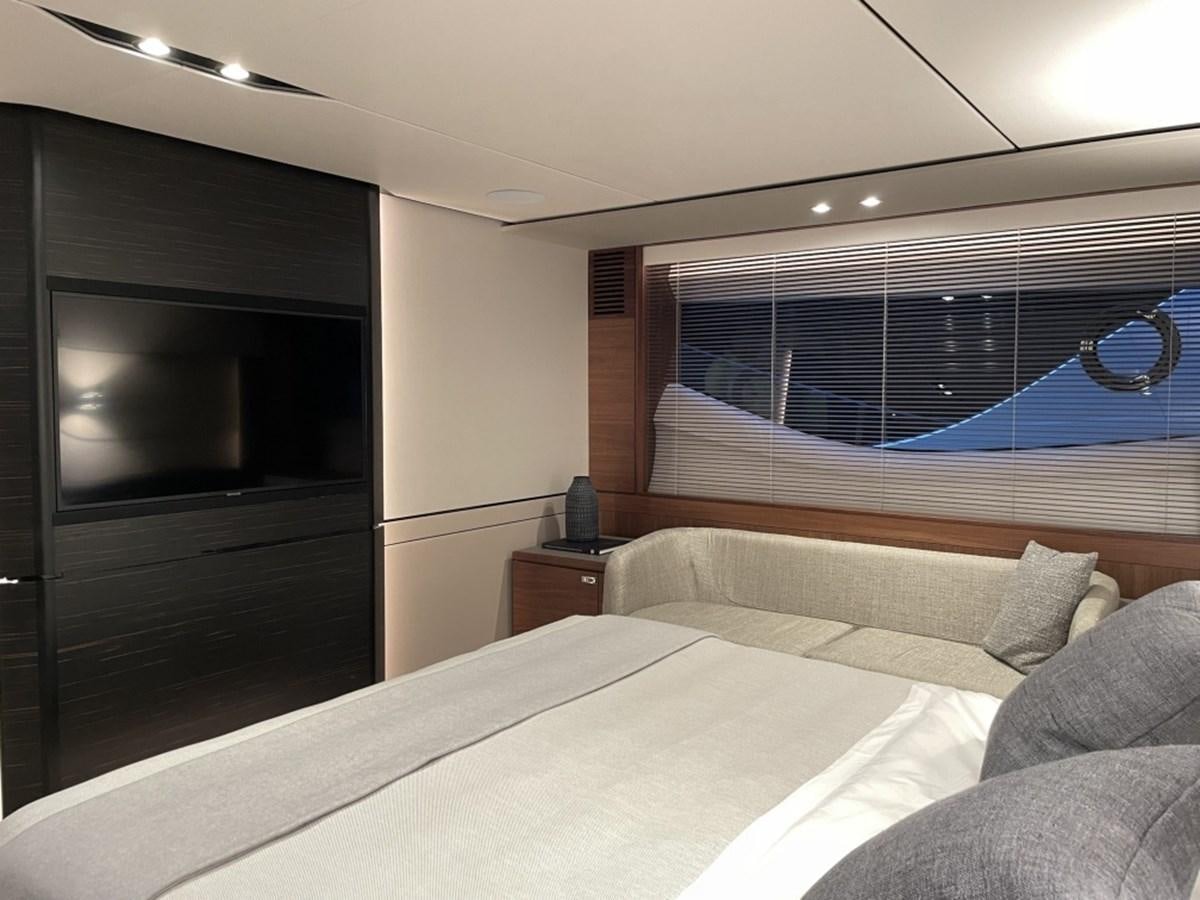 a bedroom with a bed and a television aboard PRINCESS S78 Yacht for Sale