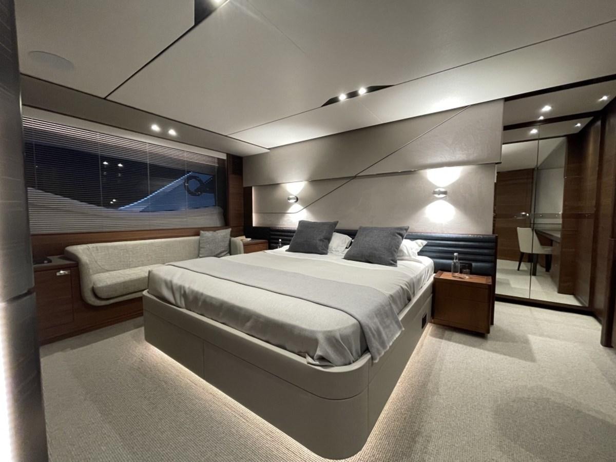 a room with a bed and a television aboard PRINCESS S78 Yacht for Sale