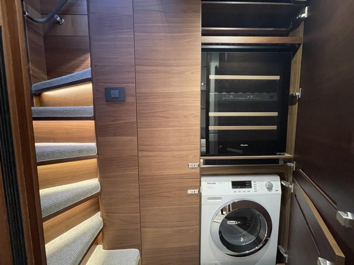 a closet with a washing machine aboard PRINCESS S78 Yacht for Sale