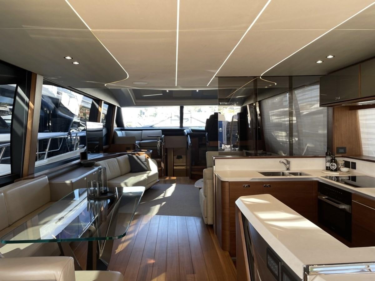 a large kitchen with a wood floor aboard PRINCESS S78 Yacht for Sale