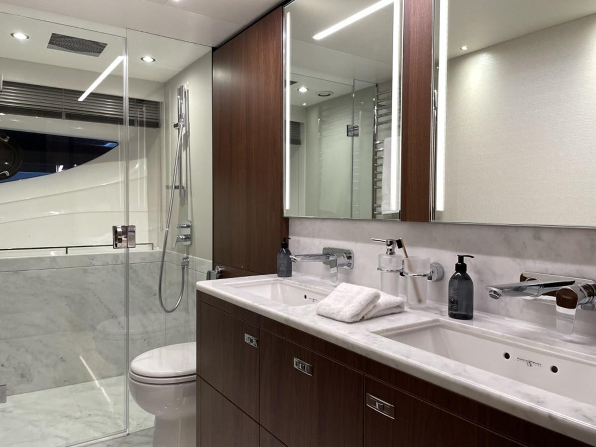 a bathroom with a glass shower aboard PRINCESS S78 Yacht for Sale